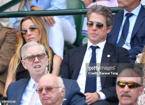 Anna Eberstein and Hugh Grant attend the men's single final on day thirteen of the Wimbledon Tennis Championships at the All England Lawn Tennis and...