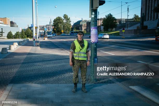 Military stands next to the Finnish Parliament in Helsinki, Finland, on July 15 ahead of the meeting between US President Donald Trump and his...