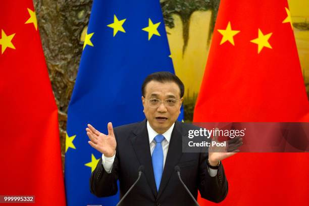 Chinese Premier Li Keqiang attends a joint press conference with European Council President Donald Tusk and European Commission President Jean-Claude...