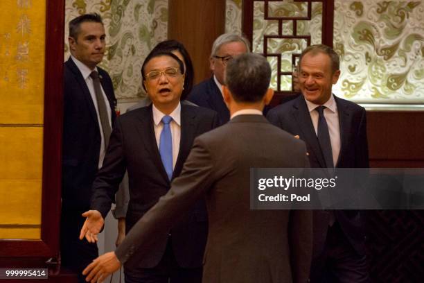 Chinese Premier Li Keqiang, European Council President Donald Tusk and European Commission President Jean-Claude Juncker arrive for a joint press...