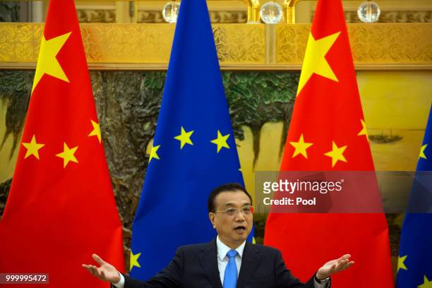 Chinese Premier Li Keqiang attends a joint press conference with European Council President Donald Tusk and European Commission President Jean-Claude...