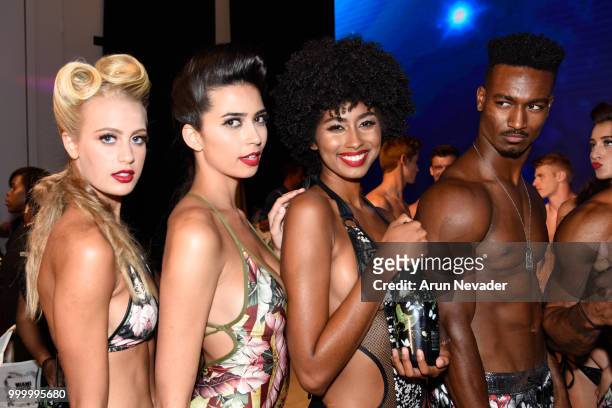 Models pose backstage at Miami Swim Week powered by Art Hearts Fashion Swim/Resort 2018/19 at Faena Forum on July 15, 2018 in Miami Beach, Florida.