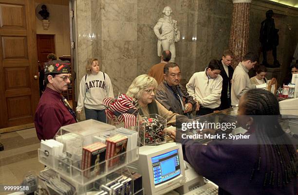 Jim and Kathy Mann make their visit to the U.S. Capitol from Oklahoma City a memorable one, by purchasing trinkets at the gift shop from Zabrina...