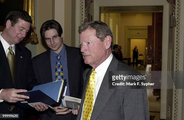 Senator James Inhofe making his way past Senator George Allen and a reporter after the Senate Luncheon on Tuesday.
