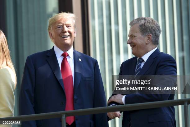 President Donald Trump and Finnish President Sauli Niinisto talk as they pose at the Mantyniemi Presidential Residence in Helsinki, on July 16, 2018...