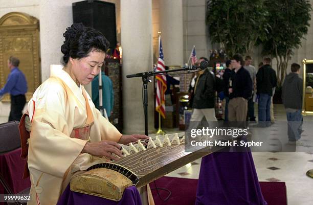 Kyoko Okamoto plays a koto, a six foot long, thirteen-string zither, for an audience in Union Staion on Wednesday. Okamoto is a certified koto...