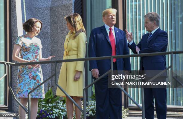 President Donald Trump and First Lady Melania Trump pose with Finnish President Sauli Niinisto and his wife Jenni Haukio at the Mantyniemi...