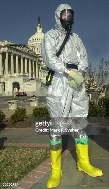 United States Marine from the Chemical Biological Response Force stands at the House Triangle at a press conference iniciated by Rep. Steny Hoyer .