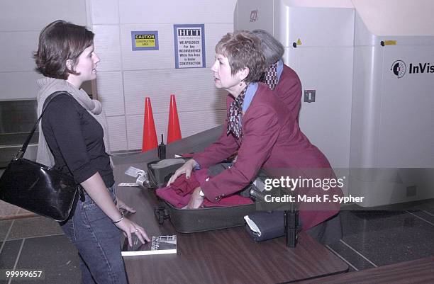 Ida Ross Swift, a Constituent Services Representative for Senator Jeff Sessions , has her bag checked by Harriet Hamilton and Jan Evans, two of the...