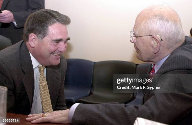 Eneryy and Commerce chair, Rep. W.J. Tauzin jokes with longtime friend Rep. John D. Dingell before a full comitte hearing on the "Lessons Learned...