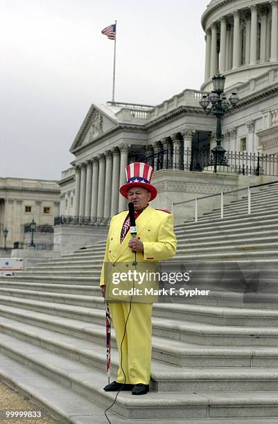Col. Oscar Poole, owner of Poole's Bar-B-Q, in East Ellijay, GA., films an advertisement on the Senate steps of the Capitol before serving a dinner...