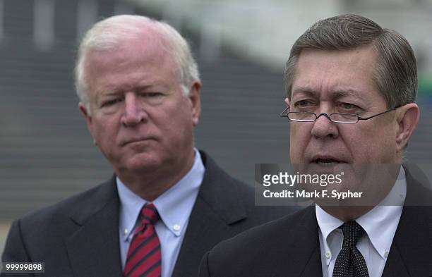 Rep. John Linder , left, joined fellow Georgia Rep. Saxby Chambliss for a rainy news conference at the House Triangle on Tuesday morning that...