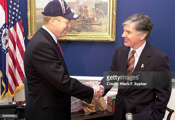 House Democratic Leader Richard A. Gephardt dons the cap of the Super Bowl Champion New England Patriots, loaned to him by Rep. Martin T. Meehan when...
