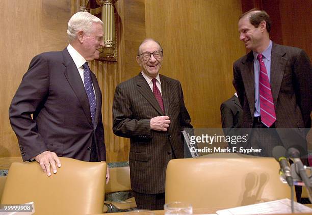 Sen. Ernest F. Hollings , left, and Sen. Ron Wyden , right, greet chairman of the Board of Govenors, Federal Reserve System, Alan Greenspan, during...