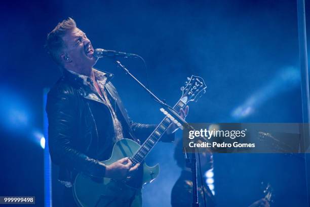 Josh Homme and Michael Shuman of Queens of the Stone Age perform on the NOS stage on day 2 of NOS Alive festival on July 13, 2018 in Lisbon, Portugal.