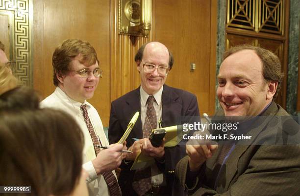 Dr. Michael West, right, President and CEO of Advanced Cell Technology, talks to reporters during an intermission at the Senate Appropriations...