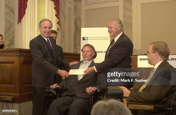 Senator Tom Harkin and Rep. Bill Young presented Christopher Reeve with a $2 million check for his Paralysis Resource Center. Rep. Jim Langevin , at...