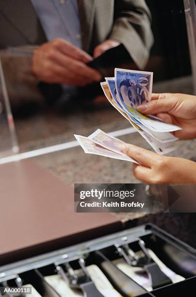 exchanging money at the currency exchange - fifty french franc note stock pictures, royalty-free photos & images