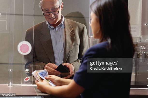 man at a currency exchange - fifty french franc note stock pictures, royalty-free photos & images