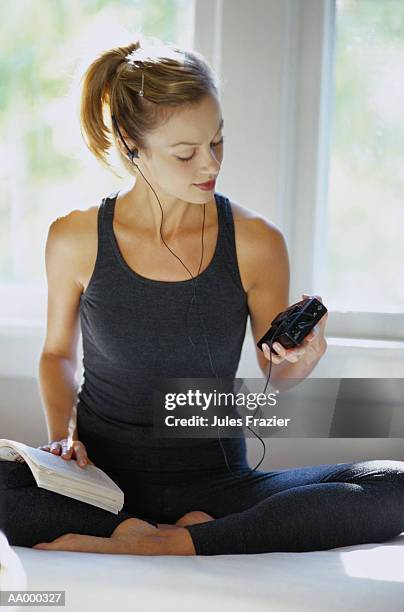 woman in a leotard listening to a portable radio - portable radio stock pictures, royalty-free photos & images