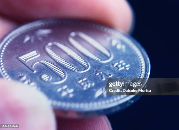 close-up of a five hundred yen coin - 500 yen coin stock pictures, royalty-free photos & images