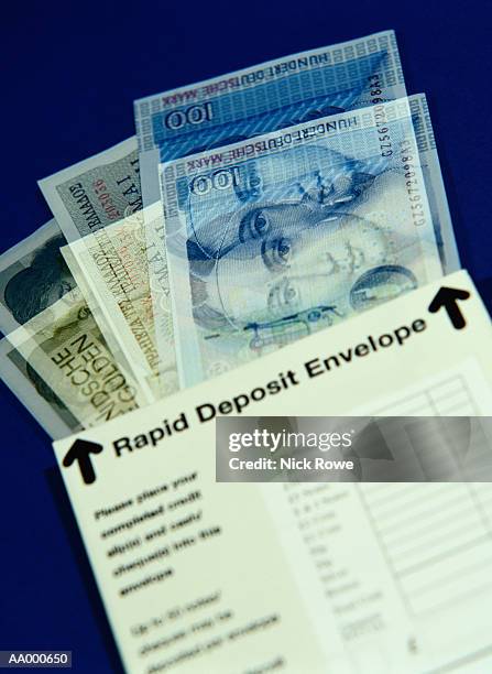 money in a rapid deposit envelope - dm stockfoto's en -beelden