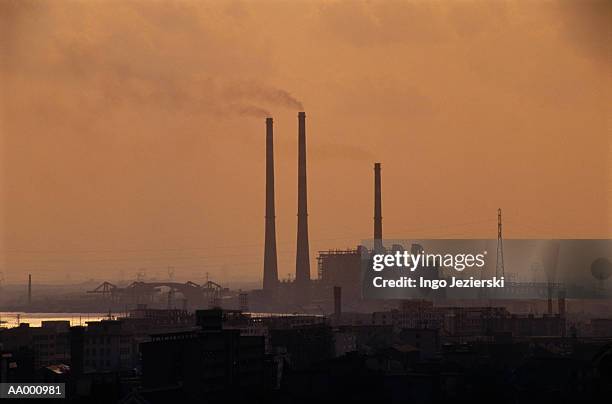 a factory at sunset in the ningbo province, china - province stock pictures, royalty-free photos & images