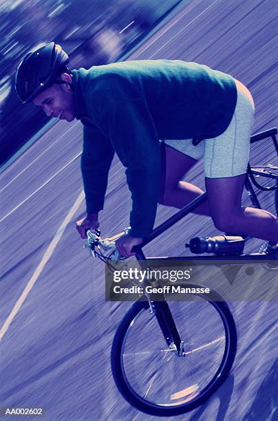 portrait of a man riding a bicycle - panorering bildbanksfoton och bilder