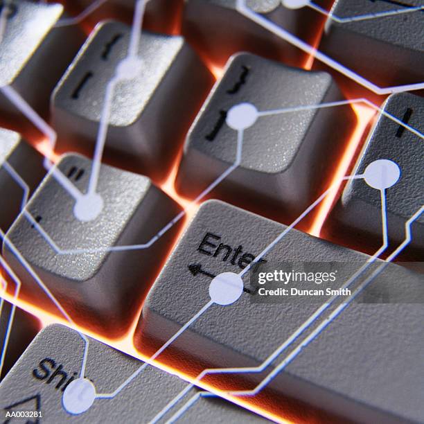 circuitry superimposed on a computer keyboard - shift key stock pictures, royalty-free photos & images