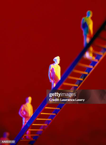 small human figurines climbing a ladder - lawrence lader stock pictures, royalty-free photos & images