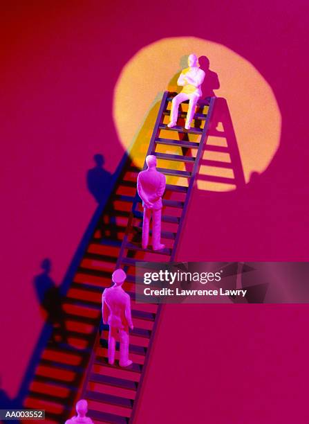 figurines climbing to the top of a ladder - lawrence lader stock pictures, royalty-free photos & images