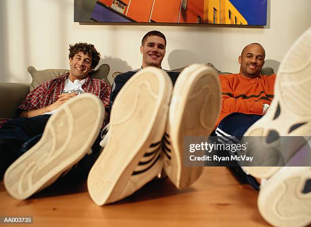 portrait of three men and their shoes - only mid adult men stock-fotos und bilder