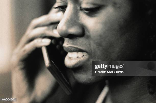 close-up of a woman using a cellular phone - hand holding flip phone imagens e fotografias de stock