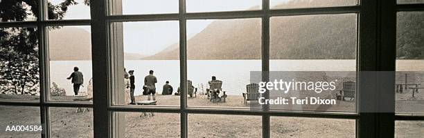 window view of people by crescent lake - lago crescent fotografías e imágenes de stock