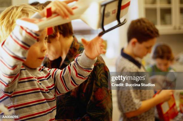 boy playing with a toy helicopter - helicopter parenting stock pictures, royalty-free photos & images