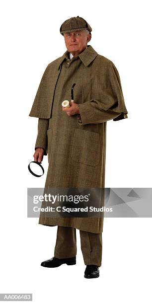 sherlock holmes holding pipe and magnifying glass - deerstalker hat stock pictures, royalty-free photos & images