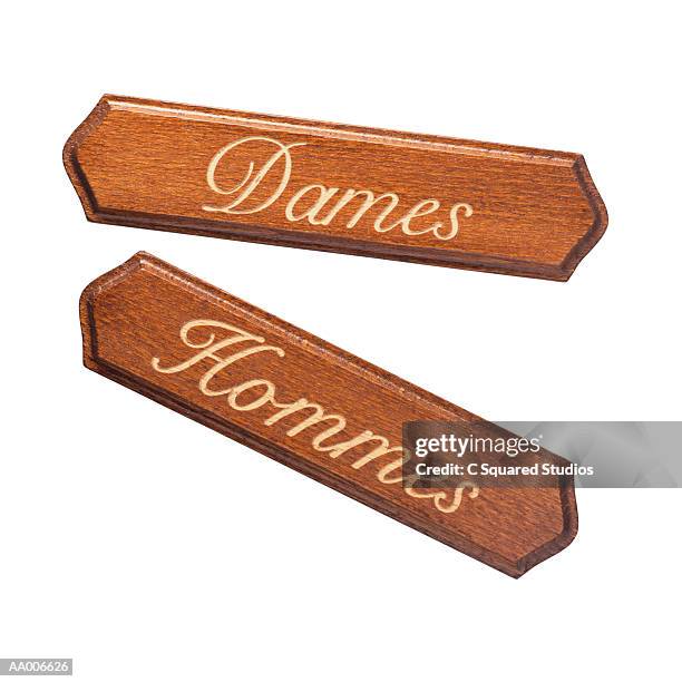 close-up of french restroom signs - hommes - fotografias e filmes do acervo