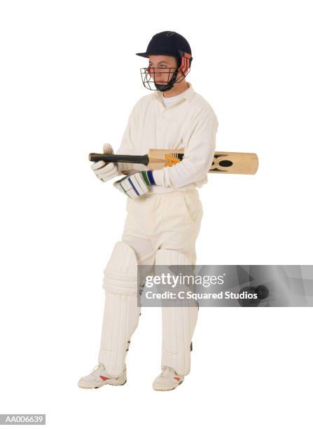 cricket player with a cricket bat - cricket player isolated stock pictures, royalty-free photos & images