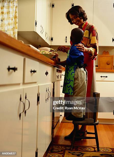 mother and son cooking in the kitchen - taburete pequeño fotografías e imágenes de stock