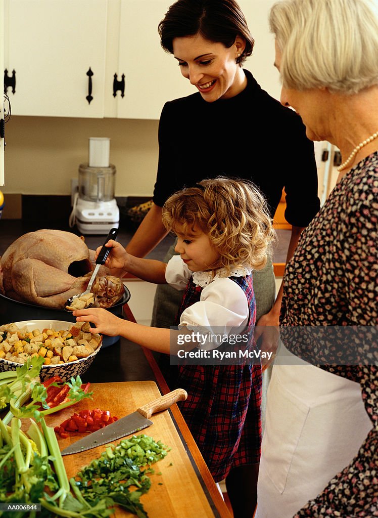 Grandmother, Mother and Granddaughter Cooking