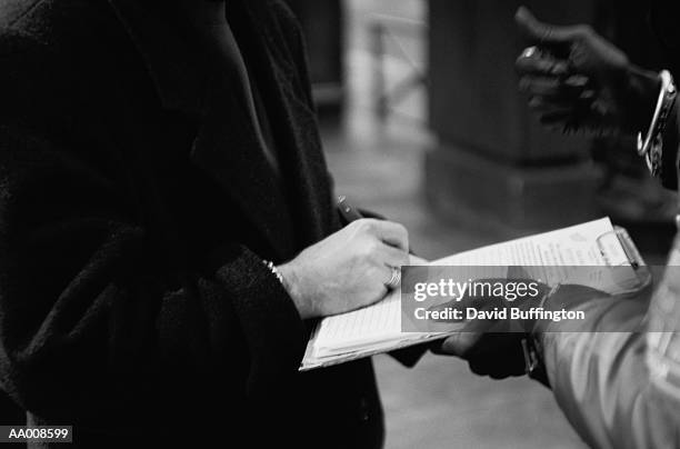 signing a petition - signing petition stock pictures, royalty-free photos & images