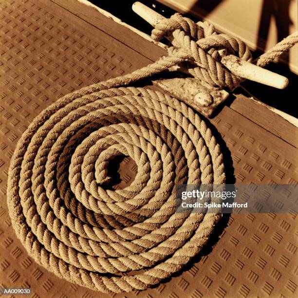 rope coiled on a deck - nautical equipment stock pictures, royalty-free photos & images