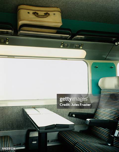 interior of train in france - luggage rack stock-fotos und bilder