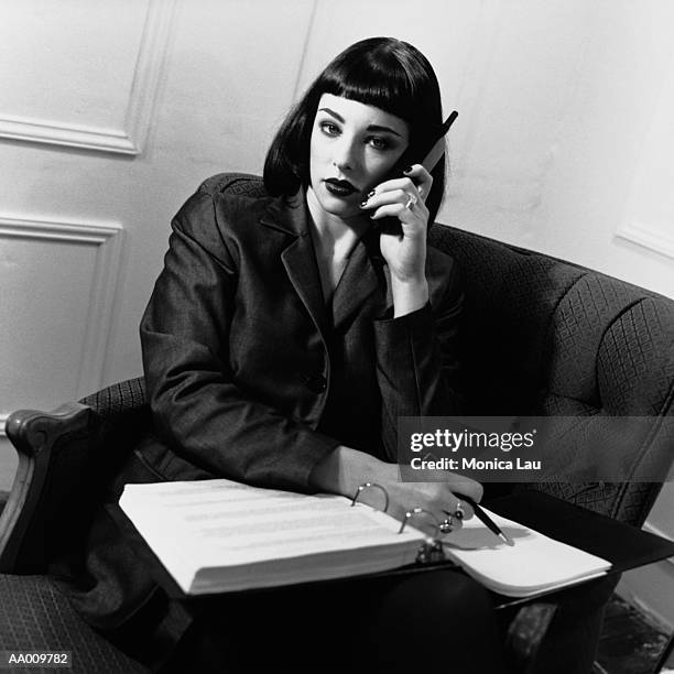 portrait of a businesswoman on a cellular phone - monica askew stock pictures, royalty-free photos & images