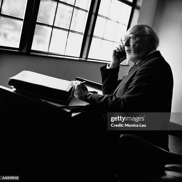 businessman thinking at desk - monica askew stock pictures, royalty-free photos & images