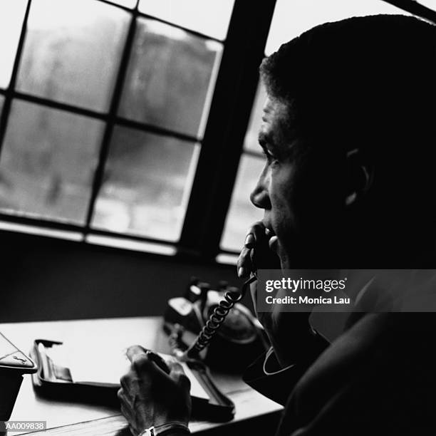 portrait of a businessman on a telephone - monica askew stock pictures, royalty-free photos & images