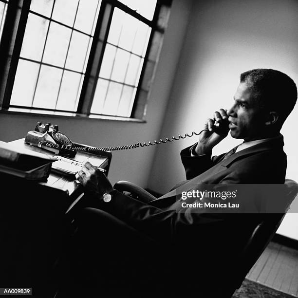 portrait of a businessman on a telephone - monica askew stock pictures, royalty-free photos & images