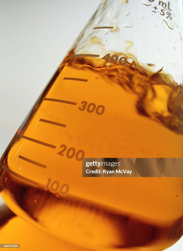 Flask Filled with Orange Liquid