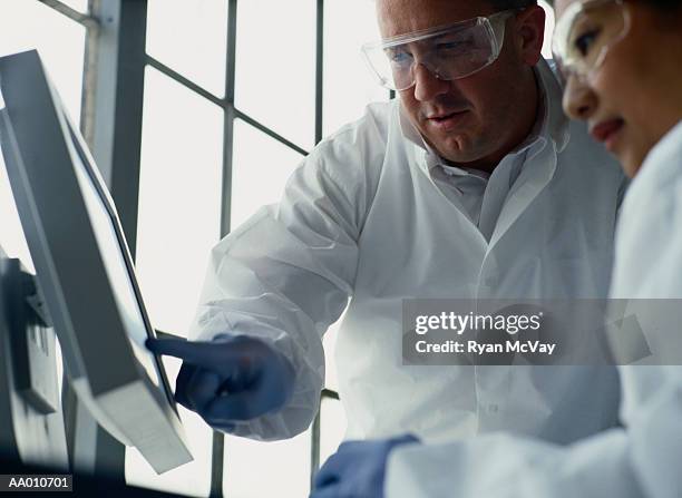 Scientist Pointing At Computer Screen Photos and Premium High Res ...