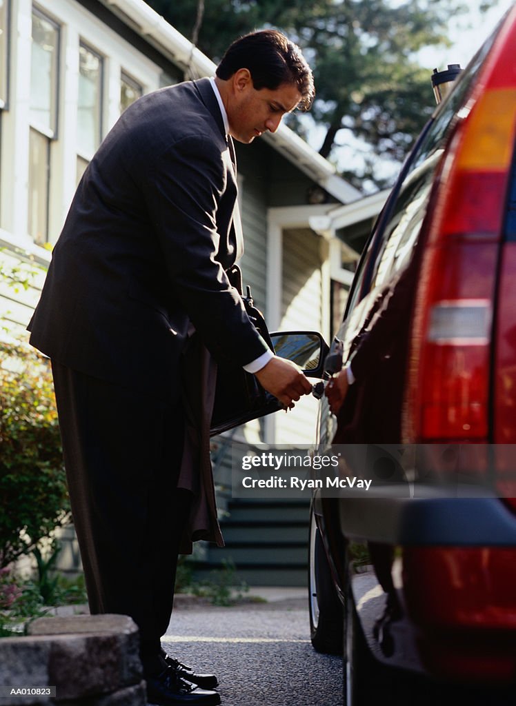 Businessman Unlocking a Car Door